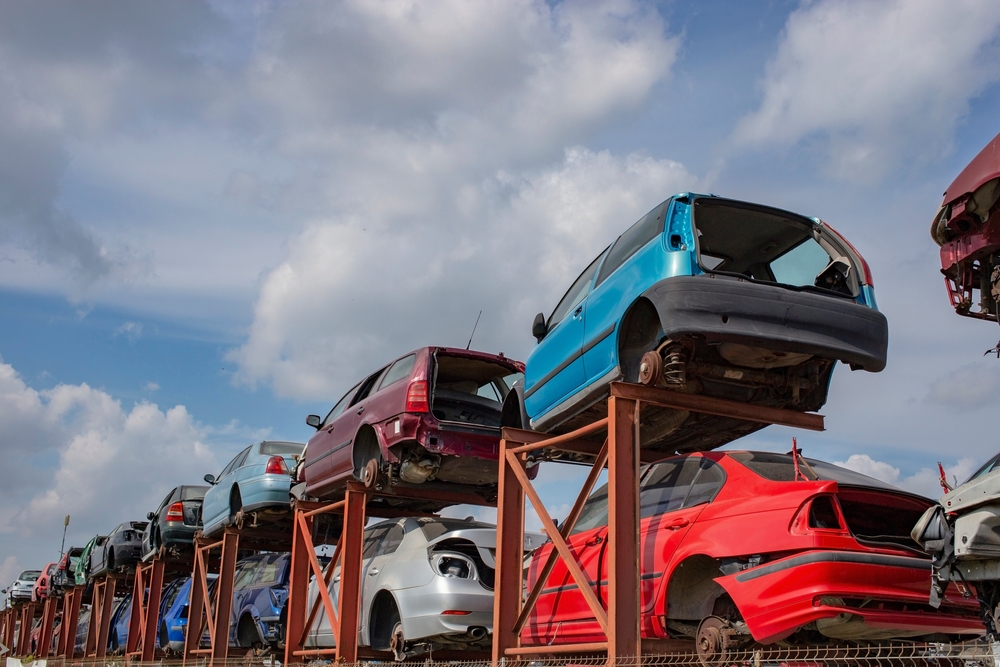 Stacked,Cars,On,A,Metallic,Frame,,Used,For,Parts.,Scrapyard